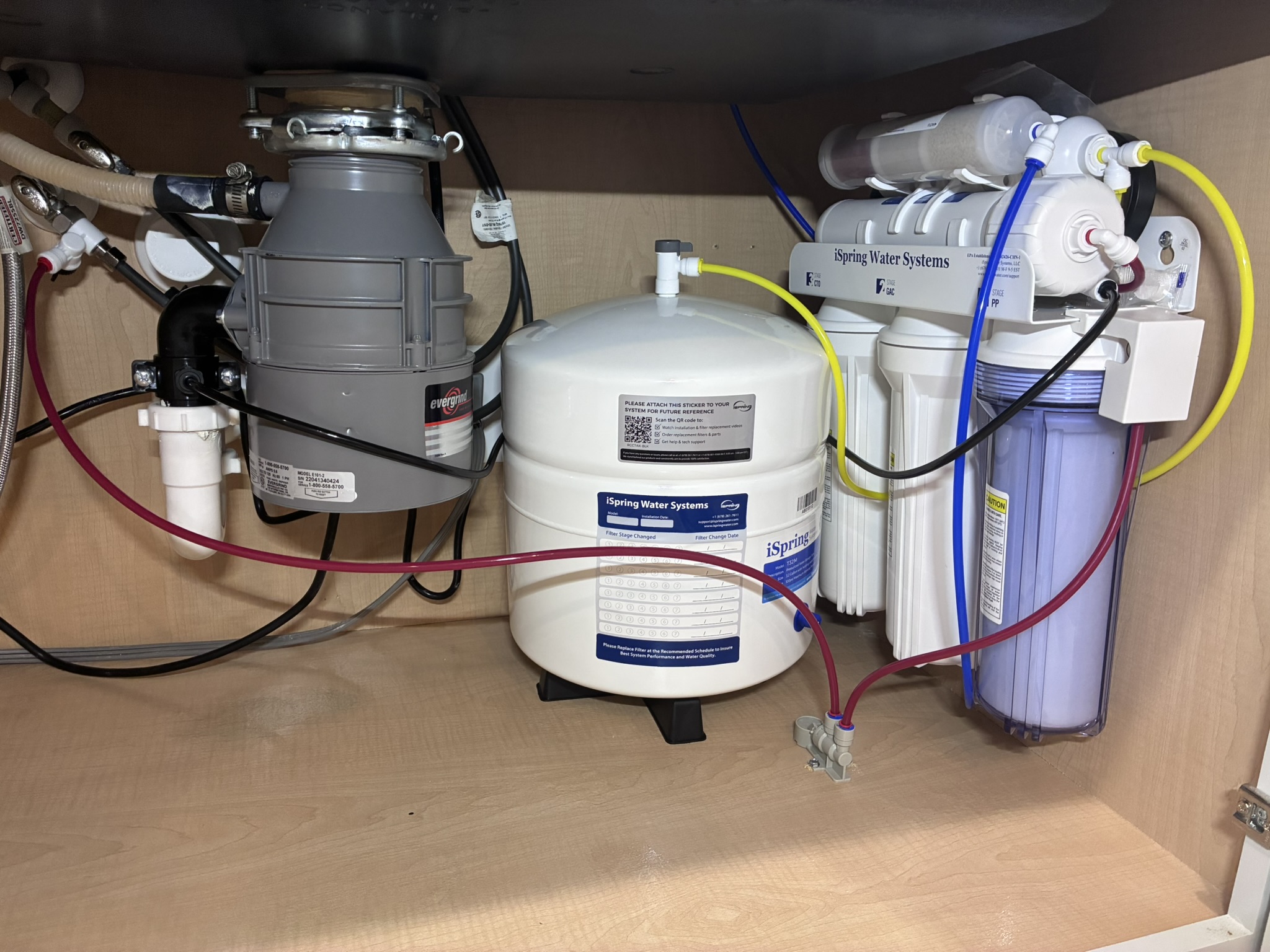 iSpring RO water filtration system installed under kitchen sink in Des Moines