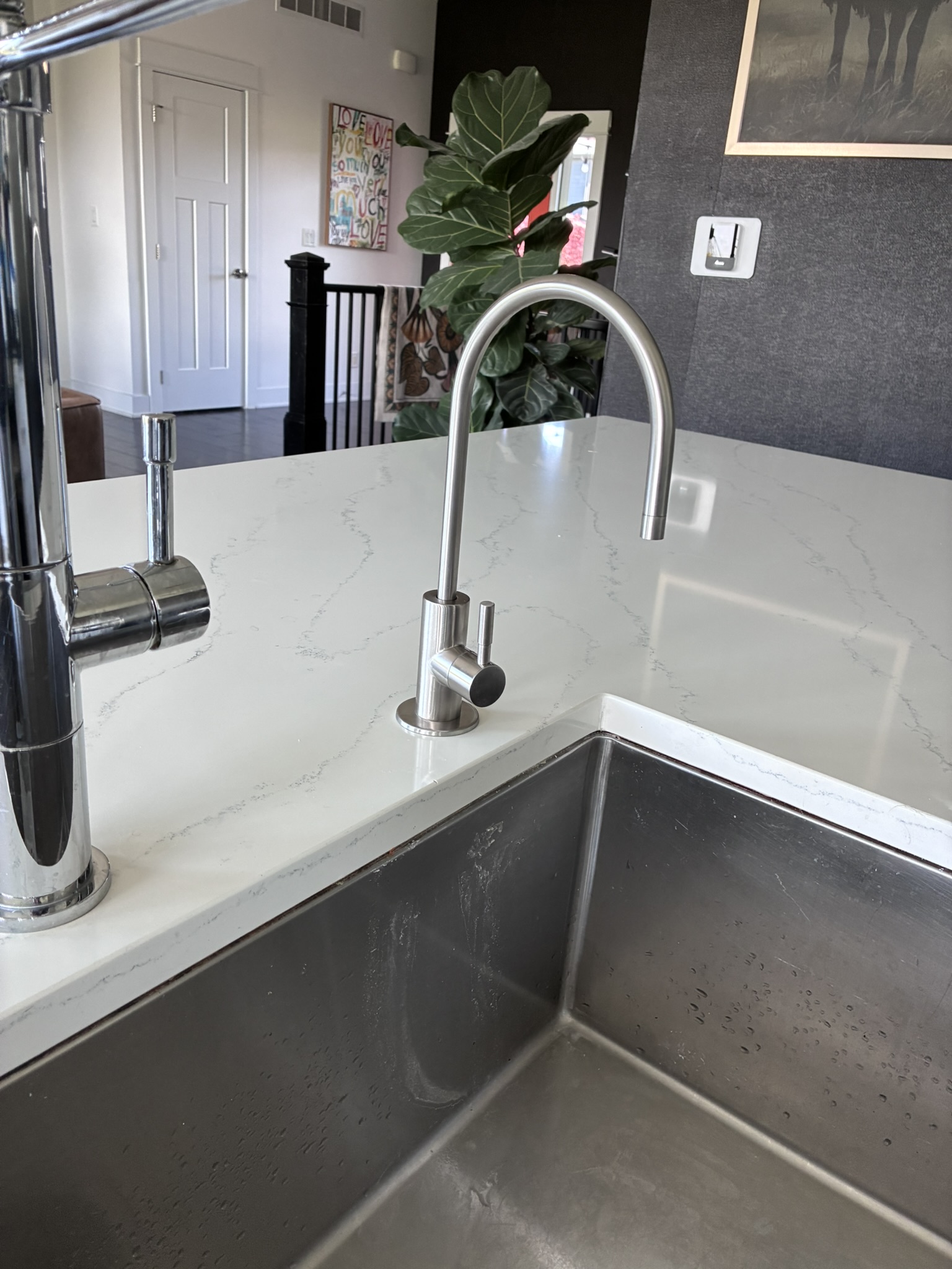 Reverse osmosis faucet installed on quartz countertop close-up