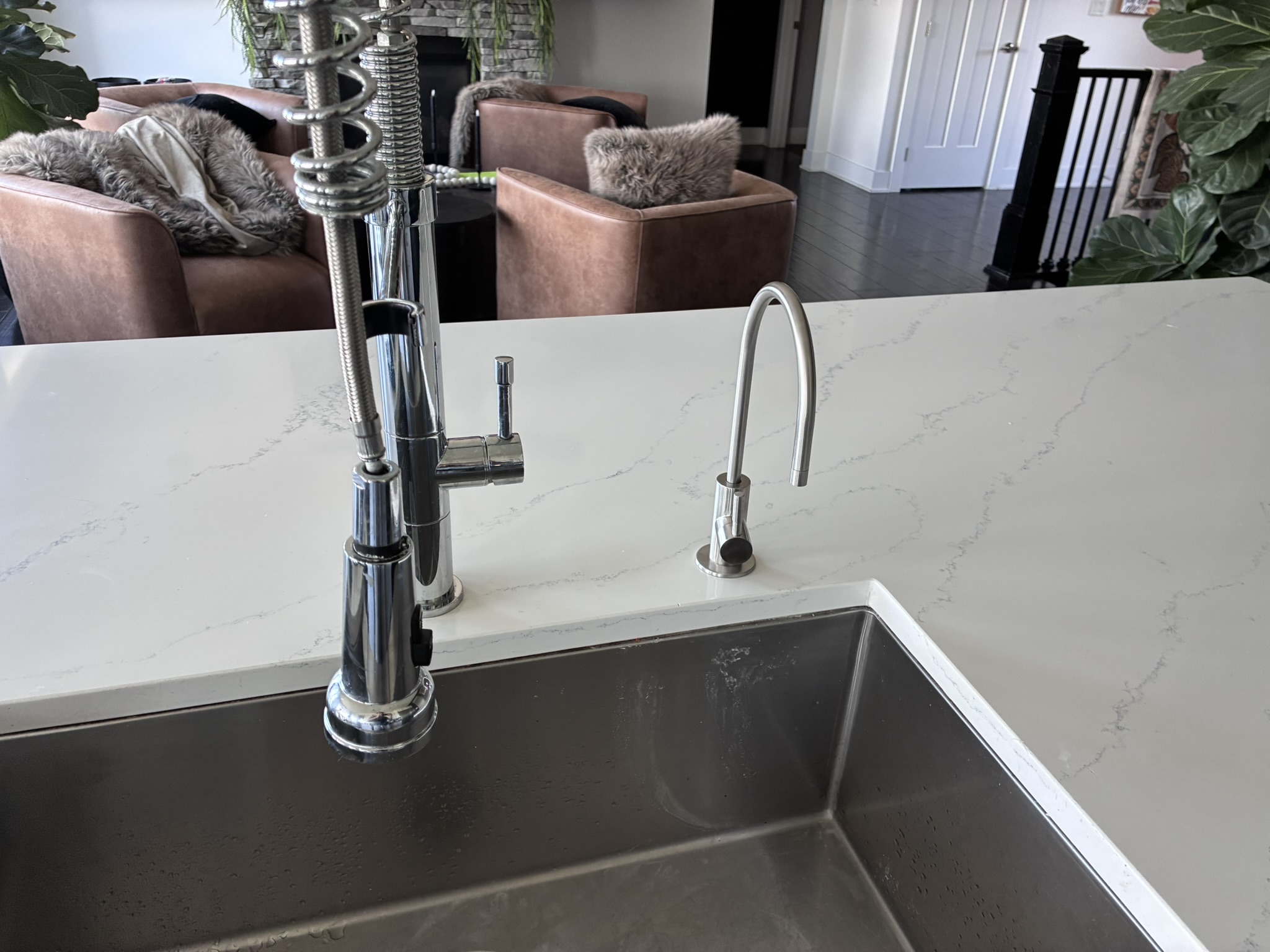 RO water faucet installed on white quartz kitchen island in Des Moines